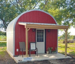 small s model massage studio with custom red front endwall and covered porch