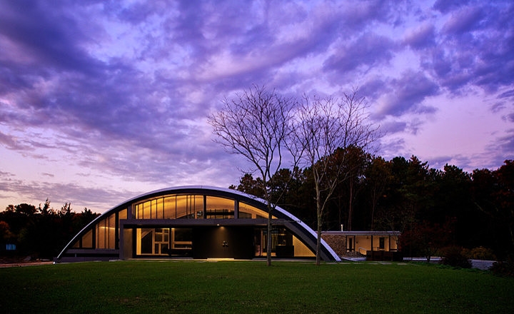 Q-Model home under a purple sky